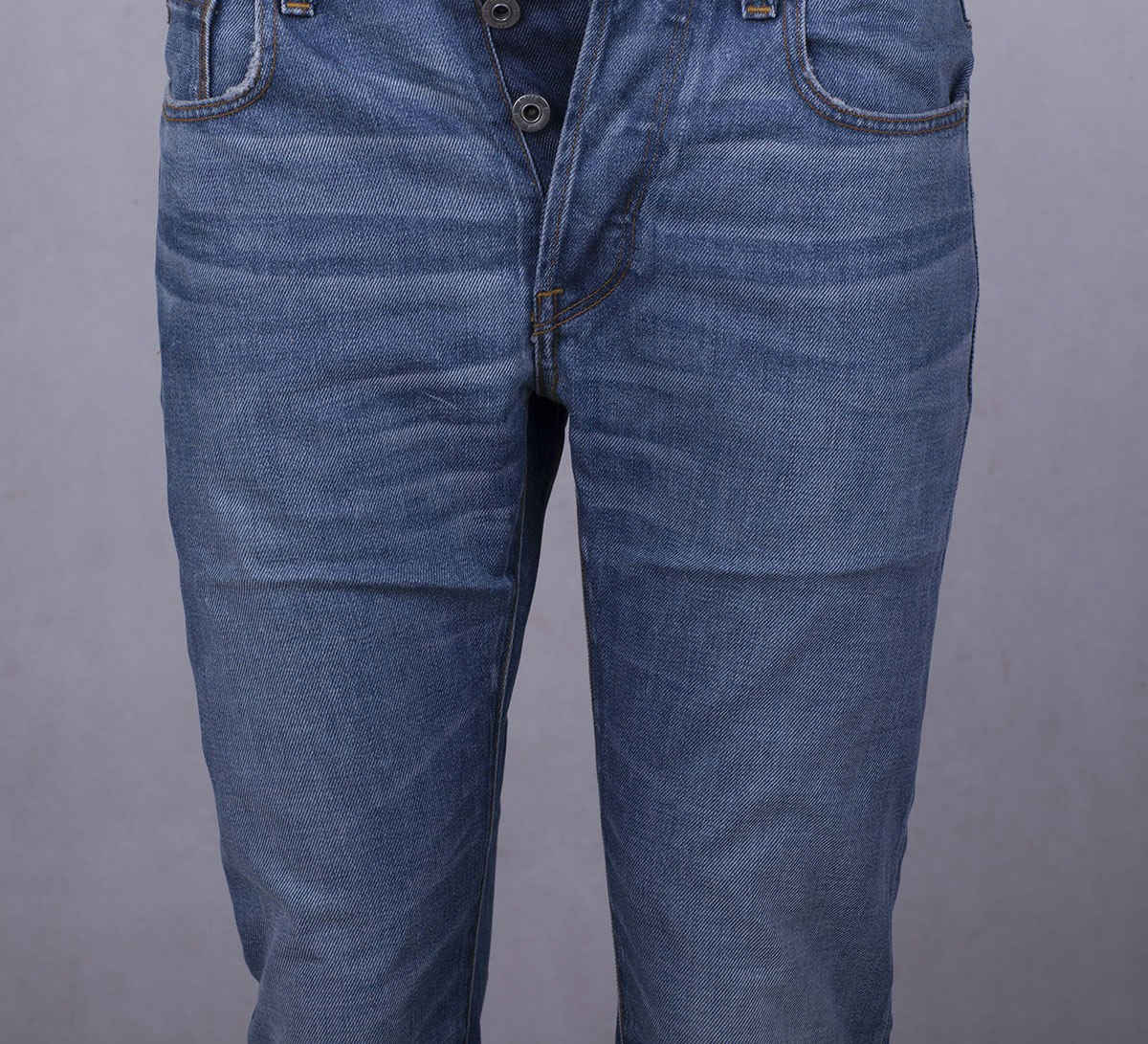 jeans-retouching-packaging-crease-removal-before Product photo of jeans showing packaging creases, before retouching